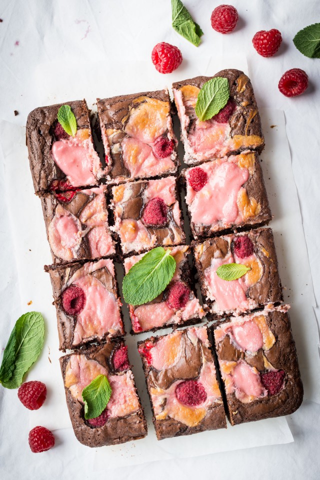 rapsberry cheese cake brownies lay flat in table cut in cubes