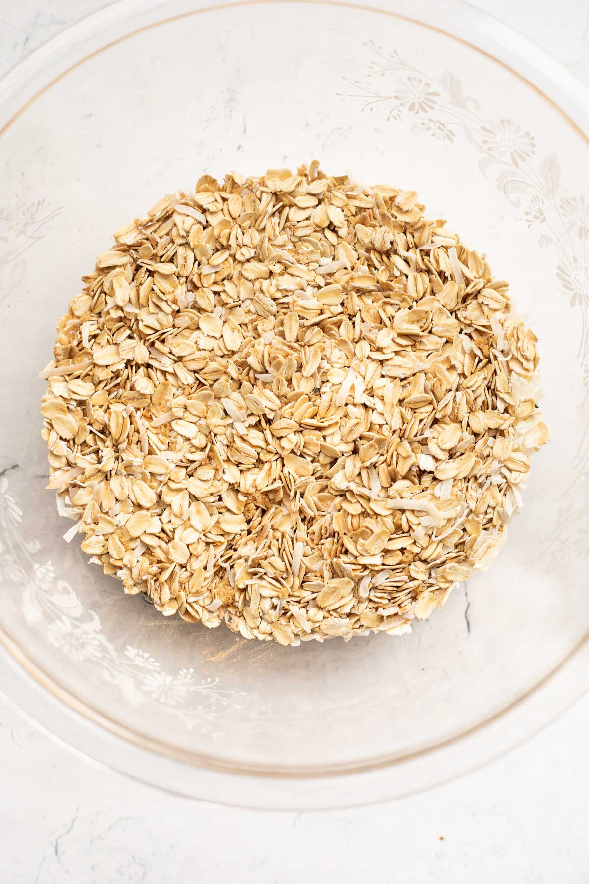 Oats and brown sugar in a glass bowl.