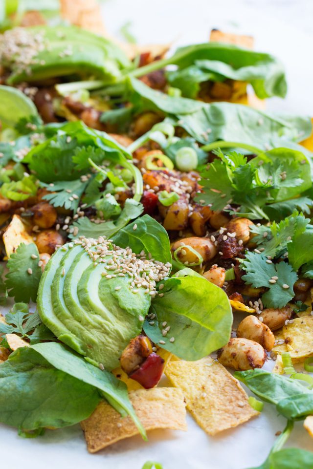 Loaded Vegan Nachos with Harissa Beans, the perfect easy snack for a hot summer's day!