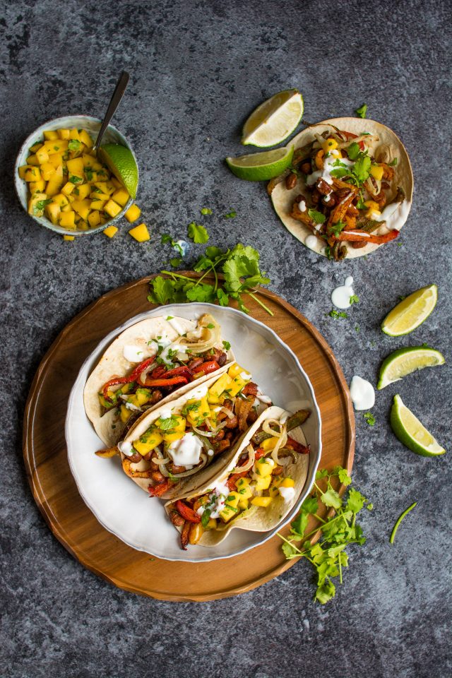 These vegan bean tacos only take one tray and are served with the freshest, zingiest mango salsa!