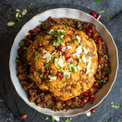 Whole Spiced Roasted Cauliflower with Spicy Lentils, a great vegan main dish!