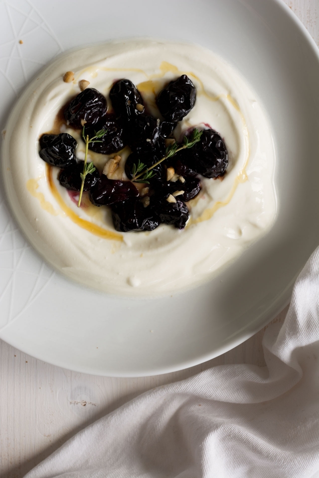 Sweet Roasted Grapes draped over thick Greek yoghurt make an easy, healthy breakfast recipe that will give you the best start to your day. Click through for the recipe!