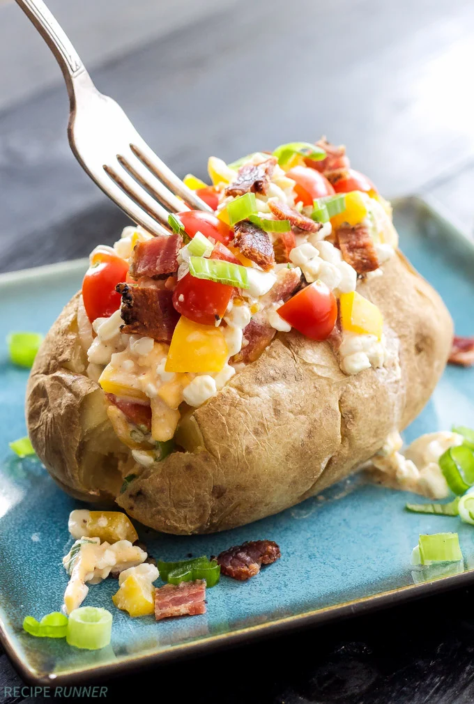 Healthy loaded baked potato with cottage cheese.